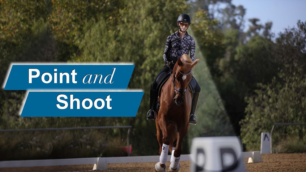A person wearing a helmet and patterned shirt rides a brown horse in an outdoor arena, with trees in the background. Text on the image reads Point and Shoot.