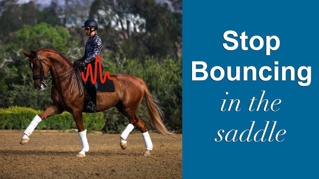 A person in riding gear is trotting on a brown horse with white leg wraps, demonstrating saddle stability. The text on the right says, Stop Bouncing in the Saddle, with a red graphic line highlighting the rider’s position.