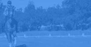 A person in equestrian attire rides a horse in an outdoor arena, with trees and a fence in the background. The image, themed for the 30 Days to Round fitness challenge, has a striking blue color overlay.