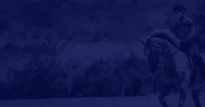 A person wearing a helmet rides a horse in an outdoor setting, embracing the challenge of 30 Days to Round. Blurry trees and hills fill the background beneath a dark blue overlay.