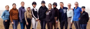 Amelia Newcomb with a group of students at an in person clinic.