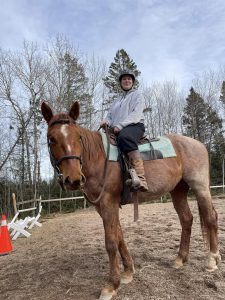 Jessica McDonald posing while on her horse.