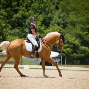 Online student Katie competing at a dressage competition.