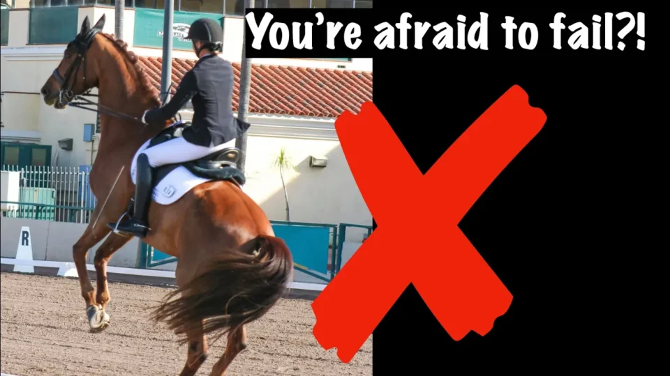A person in equestrian attire rides a horse rearing up, with a building and arena in the background. Large white text reads “You’re afraid to fail?!”—highlighting fear of failure—with a bold red “X” beside the rider.