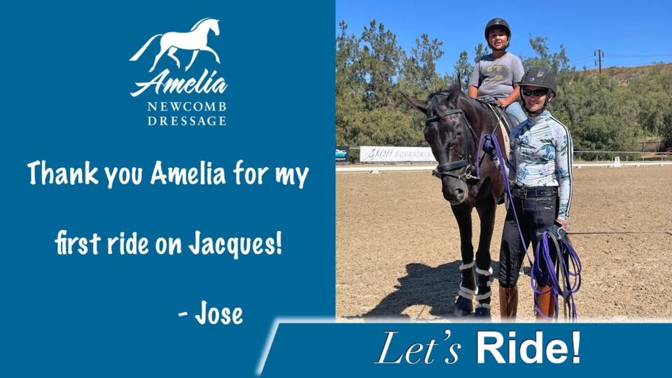 A smiling woman stands beside a black horse ridden by a child, both wearing helmets, on a sandy riding arena. Text thanks Amelia Newcomb Dressage for the ride on Jacques, signed by Jose.